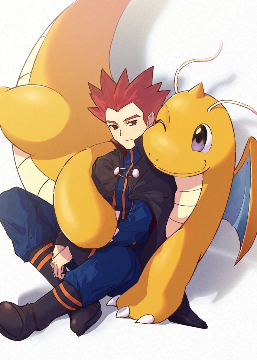 1boy anidf black_cape blue_jacket blue_pants boots cape claws closed_mouth commentary_request dragonite highres jacket lance_(pokemon) long_sleeves male_focus own_hands_together pants pokemon pokemon_(creature) pokemon_hgss popped_collar redhead short_hair sitting smile spiky_hair