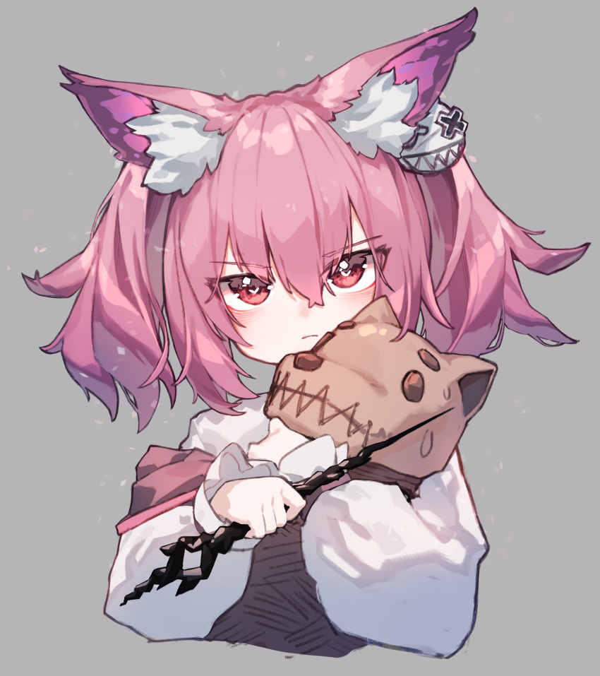 1girl absurdres animal_ear_fluff animal_ears arknights beudelb closed_mouth commentary cropped_torso fox_ears fox_girl grey_background highres holding long_sleeves looking_at_viewer morte_(arknights) pink_hair red_eyes shamare_(arknights) shirt short_hair simple_background solo stuffed_wolf twintails white_shirt