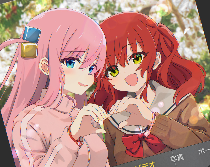 2girls blue_eyes blurry blurry_background bocchi_the_rock! bow bowtie bracelet brown_cardigan cardigan commentary_request cube_hair_ornament day dutch_angle gotoh_hitori green_eyes hair_between_eyes hair_ornament hand_up heart heart_hands heart_hands_duo highres jacket jewelry kita_ikuyo krill55 lens_flare long_hair long_sleeves looking_at_viewer multiple_girls one_side_up open_mouth outdoors pink_hair pink_jacket red_bow red_bowtie redhead sailor_collar school_uniform shuka_high_school_uniform smile track_jacket upper_body white_sailor_collar yuri