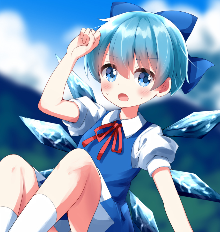 1girl alternate_hairstyle blue_bow blue_dress blue_eyes blurry blurry_background blush bow cirno clouds commentary_request detached_wings dress feet_out_of_frame hair_bow highres horizon ice ice_wings looking_at_viewer mountainous_horizon open_mouth outdoors ruu_(tksymkw) short_hair short_sleeves socks solo touhou white_socks wings