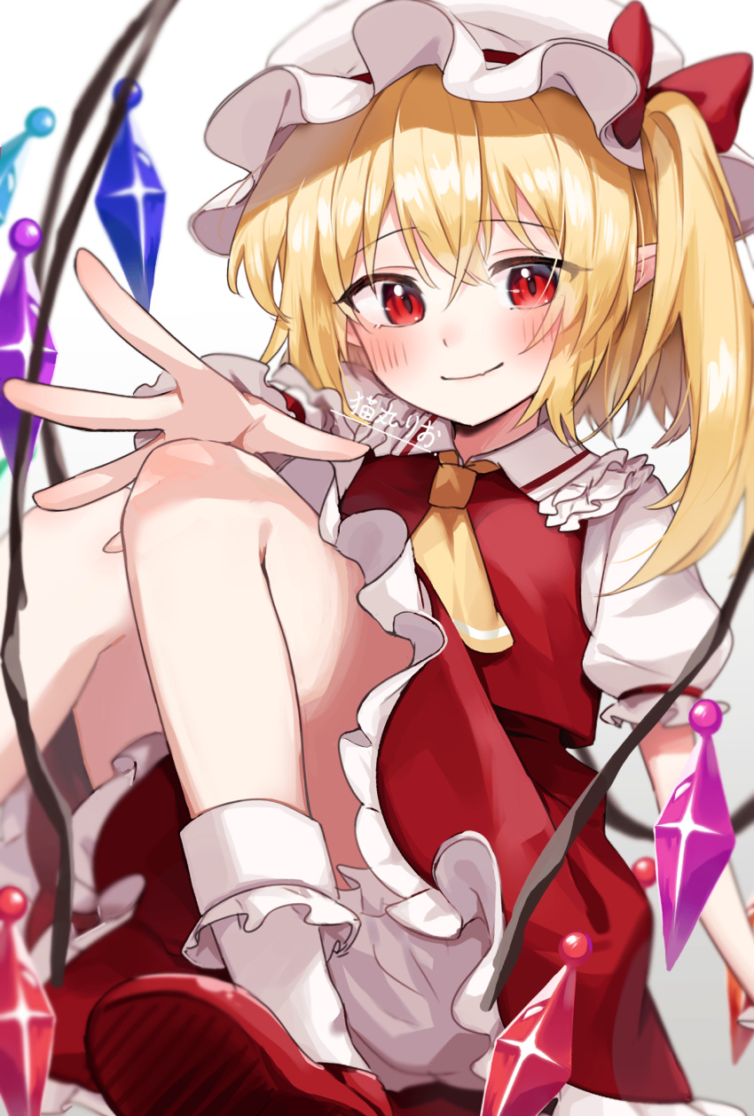 1girl arm_at_side ascot blonde_hair bloomers blurry blush bow closed_mouth commentary crossed_bangs crystal depth_of_field flandre_scarlet foot_out_of_frame frilled_shirt_collar frilled_skirt frills hair_between_eyes hand_up hat hat_bow highres knees_together_feet_apart knees_up long_hair looking_at_viewer mob_cap open_hand puffy_short_sleeves puffy_sleeves red_bow red_eyes red_footwear red_skirt red_vest shirt short_sleeves side_ponytail signature simple_background sitting skirt smile socks solo split_mouth suikario touhou tsurime vest white_background white_bloomers white_headwear white_shirt white_socks wings yellow_ascot