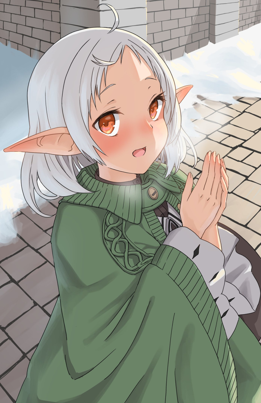 1girl ahoge breath brick_floor brick_wall cable_knit capelet dress elf green_capelet highres medium_hair mushoku_tensei open_mouth outdoors own_hands_together pointy_ears red_eyes snow solo syagare sylphiette_(mushoku_tensei) white_dress white_hair