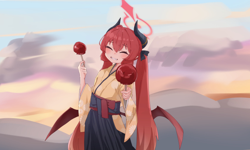 1girl absurdres black_hakama black_horns blue_archive blush brown_wings candy_apple closed_eyes demon_horns demon_wings facing_viewer food grin hair_between_eyes hakama halo highres holding holding_food horns japanese_clothes junko_(blue_archive) junko_(new_year)_(blue_archive) kimono long_hair official_alternate_costume red_halo redhead smile solo suecovsky twintails wide_sleeves wings yellow_kimono