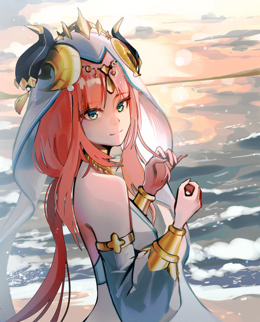1girl absurdres aqua_eyes armlet beach blue_headwear bracelet commentary crown detached_sleeves english_commentary erroten fake_horns from_side genshin_impact hands_up highres horns jewelry long_hair looking_at_viewer nilou_(genshin_impact) ocean parted_bangs pink_hair smile solo sunset twintails upper_body veil waves