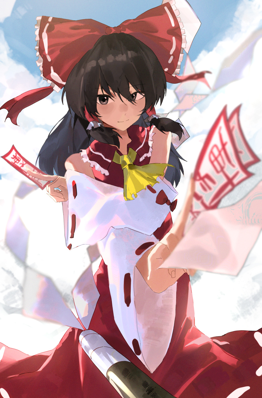 1girl absurdres ascot bare_shoulders black_hair blue_sky bow closed_mouth clouds cloudy_sky commentary crossed_arms detached_sleeves feet_out_of_frame foreshortening frilled_bow frills gohei grey_eyes hair_between_eyes hair_bow hair_ribbon hair_tubes hakurei_reimu highres holding jeiijuu looking_at_viewer nontraditional_miko omikuji outdoors red_bow red_ribbon red_skirt ribbon ribbon-trimmed_sleeves ribbon_trim romaji_commentary sidelocks skirt sky solo touhou wide_sleeves yellow_ascot