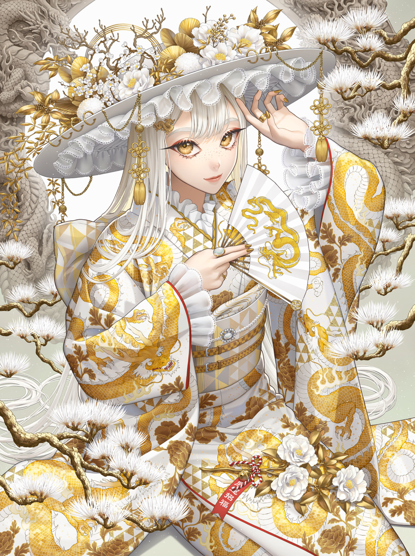 1girl arms_up branch dragon fan_print flower freckles frilled_kimono frills hand_fan hat highres holding holding_fan japanese_clothes jewelry kimono leaf long_hair looking_at_viewer minami_(minami373916) new_year obi original print_kimono ring sash smile solo white_flower white_hair yellow_eyes yellow_nails