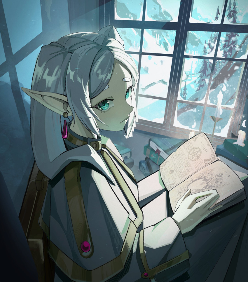 1girl backlighting book candle capelet commentary dangle_earrings earrings elf english_commentary expressionless frieren from_side gold_trim green_eyes grimoire hair_over_shoulder hand_up highres holding holding_book indoors jewelry looking_at_viewer muntins parted_bangs pointy_ears senj short_eyebrows snow solo sousou_no_frieren thick_eyebrows tree white_capelet white_hair window windowsill