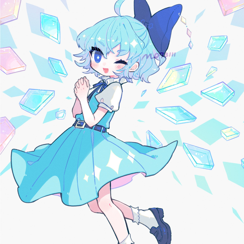 1girl ;d ahoge aqua_dress artist_name belt blue_bow blue_footwear blue_hair blue_ribbon bobby_socks bow cirno commentary_request crystal dress foot_out_of_frame hair_bow hands_up highres light_blue_hair looking_at_viewer m_(m073111) one_eye_closed open_mouth own_hands_clasped own_hands_together puffy_short_sleeves puffy_sleeves ribbon shirt short_hair short_sleeves smile socks solo touhou white_shirt white_socks