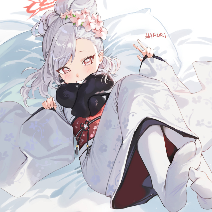 1girl bed_sheet black_scarf blue_archive blush flower grey_hair grin hair_flower hair_ornament halo haruri highres japanese_clothes kimono long_hair long_sleeves looking_at_viewer mutsuki_(blue_archive) mutsuki_(new_year)_(blue_archive) obi official_alternate_costume official_alternate_hairstyle pillow pink_flower red_eyes red_halo sash scarf signature smile socks solo white_kimono white_socks wide_sleeves