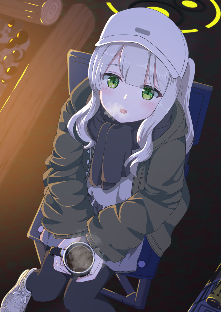 1girl black_pantyhose black_scarf blue_archive blush chair coffee cup green_eyes green_jacket grey_hair grey_shorts halo hare_(blue_archive) hare_(camp)_(blue_archive) hat highres holding holding_cup hood hood_down hooded_jacket jacket long_hair long_sleeves looking_at_viewer official_alternate_costume open_mouth pantyhose ponytail scarf shoes shorts sitting smile solo syimo white_footwear white_headwear