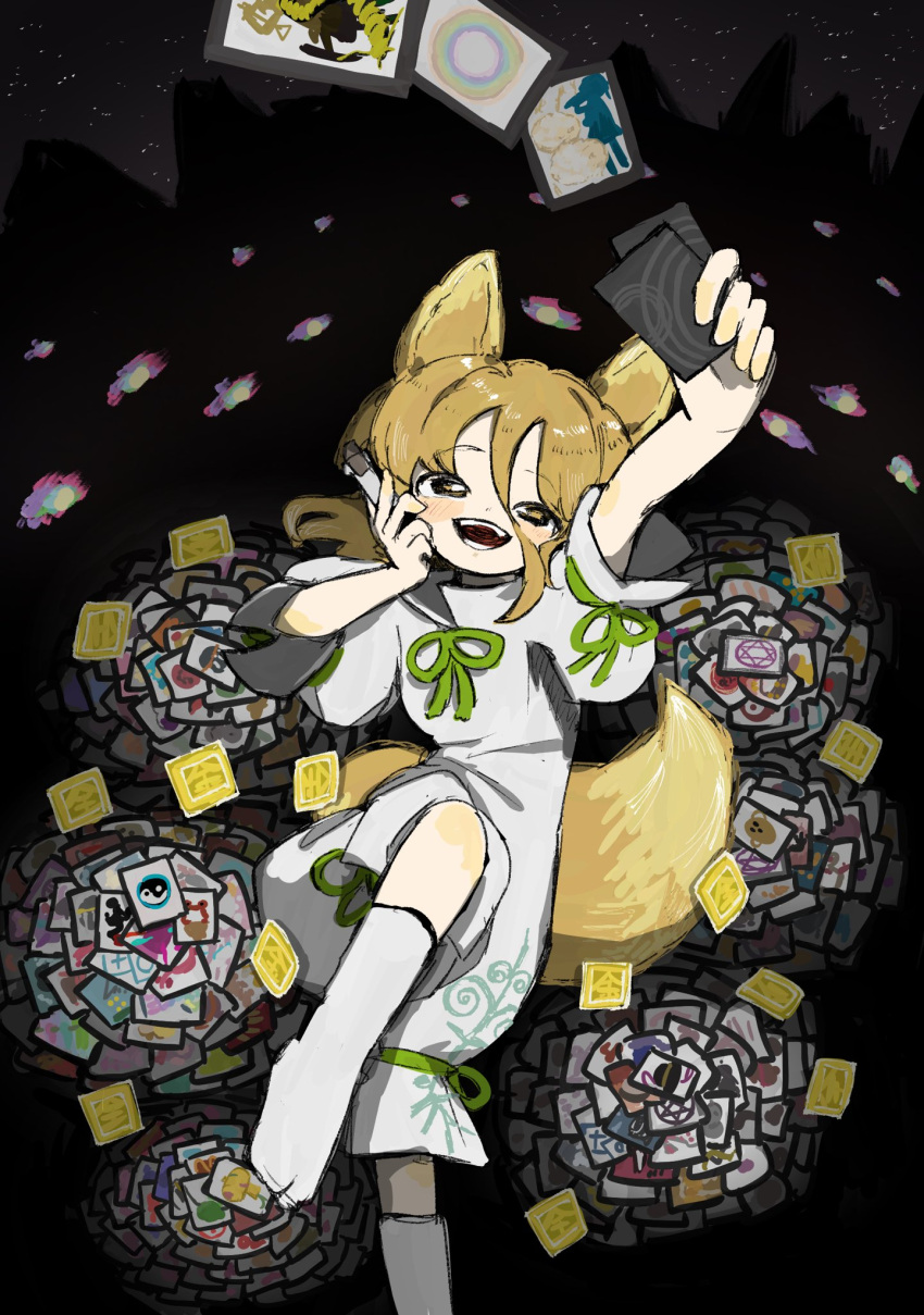 1girl ability_card_(touhou) animal_ears arm_up black_background card foot_out_of_frame fox_ears fox_girl fox_tail green_ribbon hair_between_eyes highres holding holding_card kudamaki_tsukasa light_brown_hair long_hair_between_eyes neruzou no_shoes open_mouth ribbon short_sleeves smile socks solo tabi tail touhou white_romper white_socks