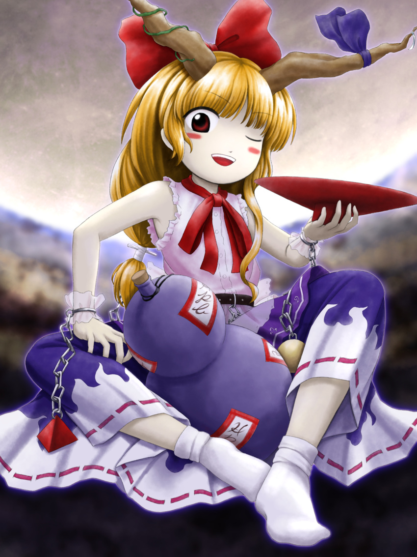 1girl blonde_hair blue_ribbon blue_skirt blurry blurry_background blush bottle bow buttons chain cup flat_chest frilled_shirt frills full_body gourd hair_bow highres holding holding_cup horn_ornament horn_ribbon horns ibuki_suika long_hair looking_at_viewer low-tied_long_hair neck_ribbon no_shoes official_style ofuda one_eye_closed open_mouth parasite_oyatsu pink_shirt print_skirt red_bow red_eyes red_ribbon ribbon ribbon-trimmed_skirt ribbon_trim sakazuki shirt sitting skirt sleeveless sleeveless_shirt smile socks solo touhou white_socks wrist_cuffs zun_(style)