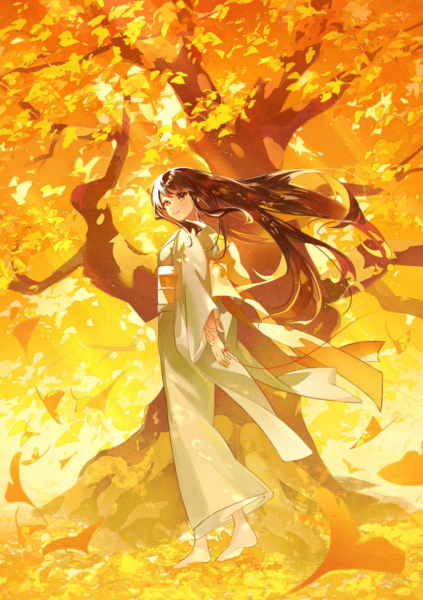 1girl absurdres autumn autumn_leaves barefoot bow brown_hair closed_mouth day falling_leaves ginkgo_leaf grey_kimono hand_on_own_wrist highres japanese_clothes kimono leaf long_hair long_sleeves looking_at_viewer looking_to_the_side nature obi original red_eyes sash smile solo string string_of_fate toumin_(onemunemu99) tree under_tree very_long_hair walking wide_shot wind yellow_bow yellow_theme