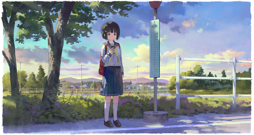 1girl backpack bag black_footwear black_hair blue_eyes blue_sailor_collar blue_skirt blue_sky bus_stop cellphone closed_mouth clouds commentary_request dot_mouth feel_(nasitaki) field full_body grass hair_ornament hairclip highres holding holding_phone house morning mountainous_horizon original outdoors phone pleated_skirt power_lines railing red_bag road road_sign sailor_collar scenery shirt short_hair sign skirt sky smartphone socks solo standing tree white_shirt white_socks