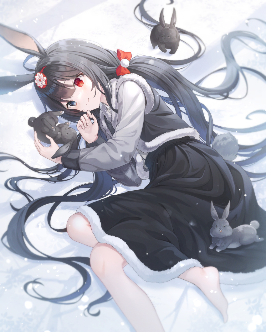 1girl absurdres ahoge animal_ears barefoot black_eyes black_hair black_hanbok black_skirt bow closed_mouth english_commentary foot_out_of_frame fur_trim hair_bow hair_ornament hanbok hands_up heterochromia highres korean_clothes looking_at_animal low_twintails lying on_ground on_side original pom_pom_(clothes) pom_pom_hair_ornament rabbit rabbit_ears rabbit_girl rabbit_tail red_eyes shadow skirt smile snow solo ssalgolae sunlight tail twintails