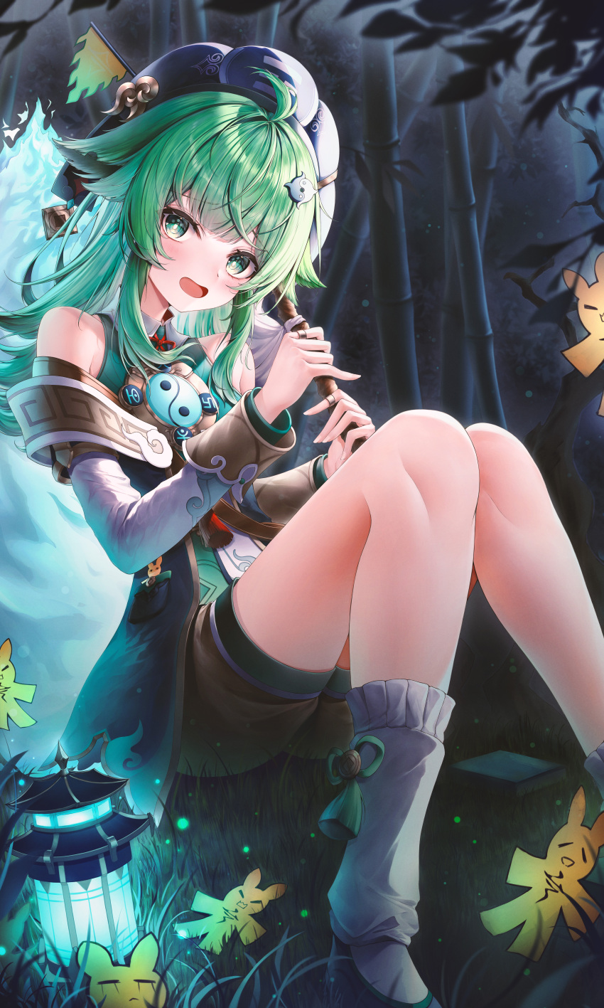 1girl absurdres ahoge animal_ears bamboo bamboo_forest black_headwear brown_shorts chinese_commentary english_commentary fiery_tail fingernails forest fox_ears fox_girl fox_tail green_eyes green_footwear green_hair highres holding honkai:_star_rail honkai_(series) huohuo_(honkai:_star_rail) ichizon knees_up korean_commentary leg_warmers light_blush looking_at_viewer mixed-language_commentary nature on_ground open_mouth paper_doll paw-shaped_pupils shorts sitting tail tail_(honkai:_star_rail) tassel white_leg_warmers yin_yang_hair_ornament