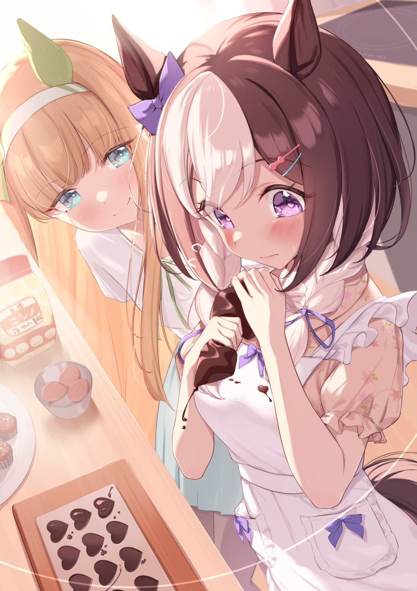2girls animal_ears apron aqua_eyes bow brown_hair candy chocolate chocolate_on_clothes closed_mouth commentary_request ear_bow ear_covers food hairband heart heart-shaped_chocolate highres horse_ears horse_girl horse_tail long_hair looking_at_another multicolored_hair multiple_girls orange_hair purple_bow saboten_mushi short_hair silence_suzuka_(umamusume) smile special_week_(umamusume) tail two-tone_hair umamusume violet_eyes white_apron white_hair white_hairband