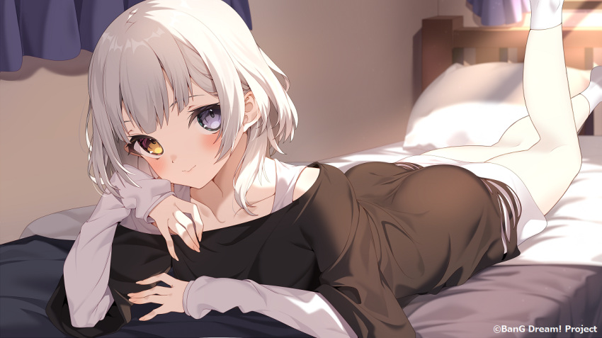 1girl bang_dream! bang_dream!_it's_mygo!!!!! bed bedroom black_shirt blue_eyes collarbone copyright_name guest_art heterochromia indoors jun_(aousa0328) kaname_raana long_sleeves looking_at_viewer lying official_art on_bed on_stomach second-party_source shirt short_hair socks solo sunlight the_pose white_hair white_shirt white_socks yellow_eyes