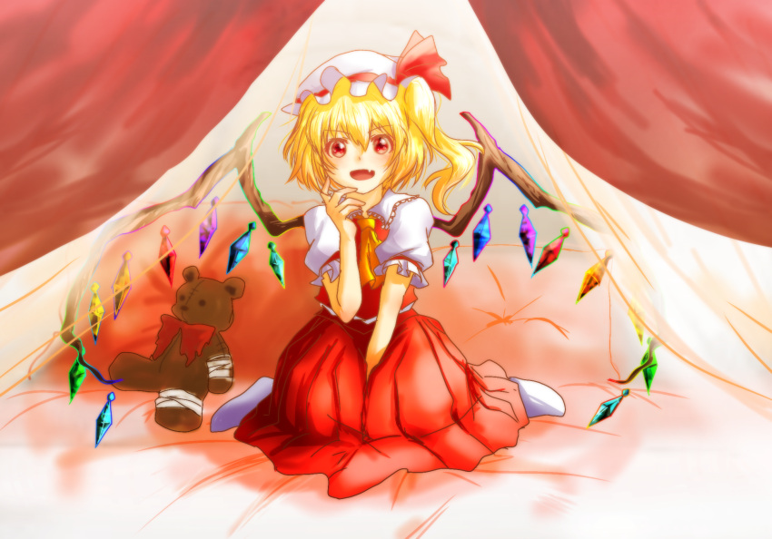 1girl ascot bed blonde_hair braid curtains flandre_scarlet hat highres medium_hair mob_cap on_bed pillow red_ascot red_eyes shee_take sitting socks solo stuffed_animal stuffed_toy teddy_bear touhou white_socks wings