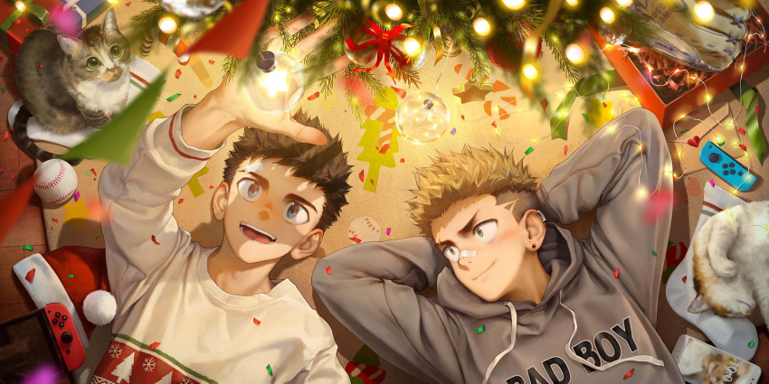 2boys arms_behind_head baseball beitemian blonde_hair blue_eyes brown_hair cat christmas_sweater christmas_tree closed_mouth ear_piercing english_text green_eyes hat highres long_sleeves looking_at_another lying male_focus multiple_boys nintendo_switch on_back on_floor open_mouth original piercing reaching santa_hat shaded_face smile teeth undercut