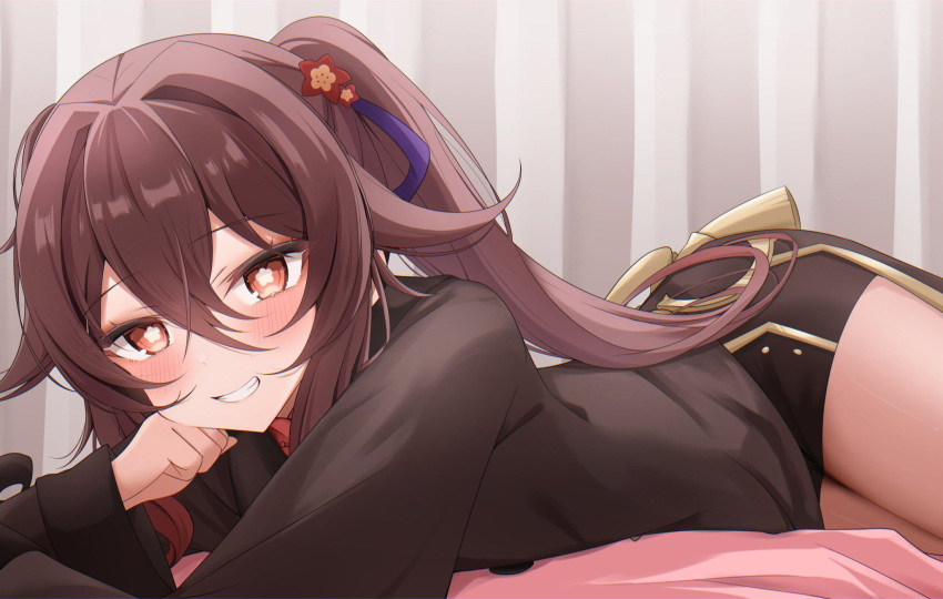 1girl black_shorts blush brown_hair chinese_clothes coattails flower flower-shaped_pupils genshin_impact hair_flower hair_ornament highres hu_tao_(genshin_impact) komor_yuki long_hair long_sleeves looking_at_viewer on_bed plum_blossoms red_eyes red_shirt shirt shorts smile solo symbol-shaped_pupils tailcoat thighs twintails