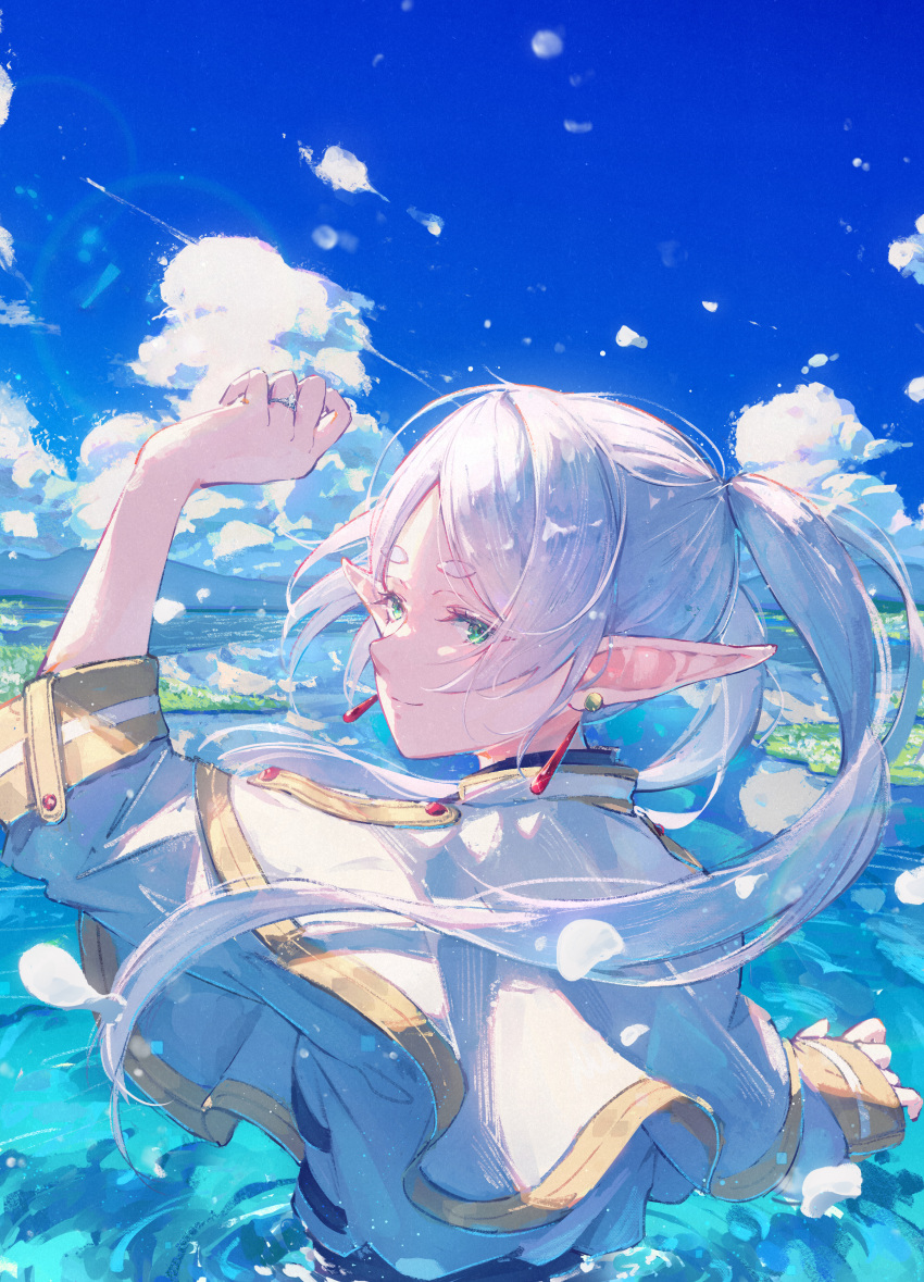 1girl absurdres capelet clouds cloudy_sky earrings frieren fuunyon highres jewelry looking_at_viewer looking_back ocean pointy_ears sky smile solo sousou_no_frieren white_capelet white_hair