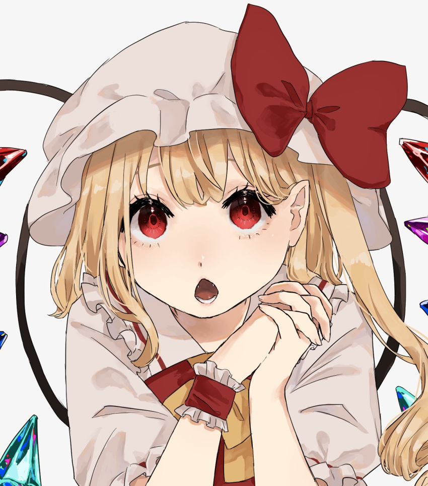 1girl :o blonde_hair bow commentary_request crystal eyebrows_hidden_by_hair fangs flandre_scarlet hair_behind_ear hands_up hat hat_bow highres karura_2344 long_hair looking_at_viewer mob_cap open_mouth own_hands_clasped own_hands_together pointy_ears puffy_short_sleeves puffy_sleeves red_bow red_eyes short_sleeves solo touhou upper_body white_headwear wings