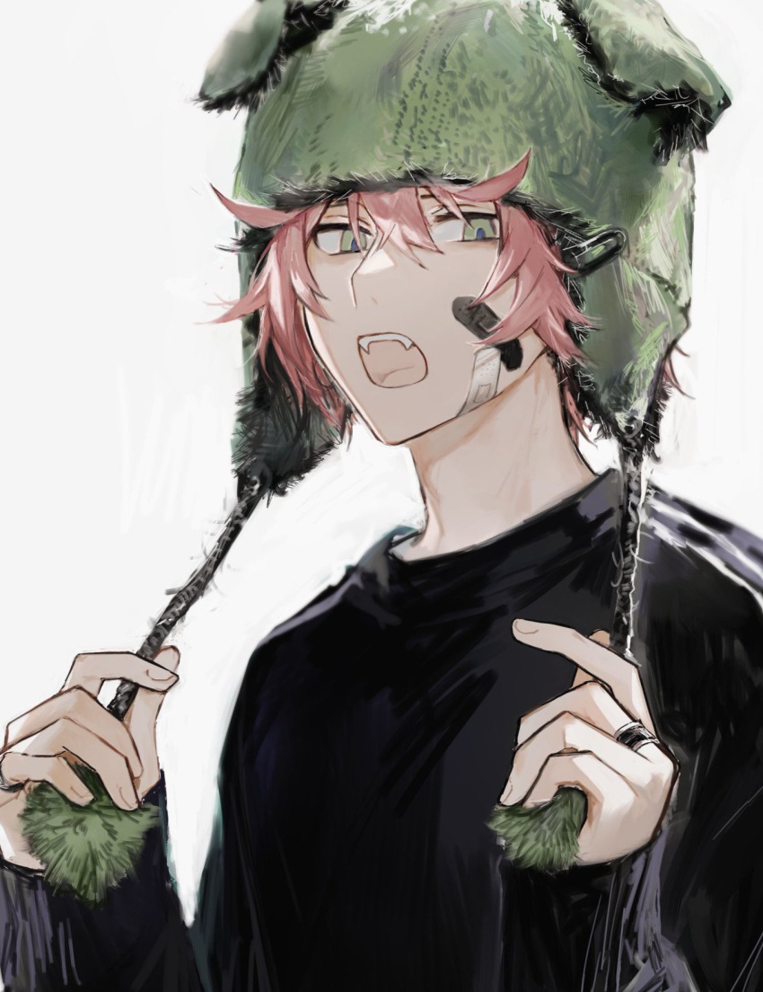 1boy bandaid bandaid_on_face beanie black_shirt earflap_beanie fangs green_eyes hair_between_eyes hands_up hat highres holding holding_clothes holding_hat jewelry long_sleeves looking_at_viewer male_focus messy_hair open_mouth original pale_skin pink_hair pom_pom_(clothes) pom_pom_beanie ring shirt short_hair slit_pupils solo suechimu teeth upper_body upper_teeth_only white_background