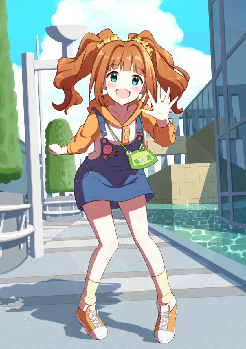 1girl animal_bag badge bag blue_eyes blunt_bangs blush button_badge commentary day english_commentary flower full_body hair_flower hair_ornament highres hood hoodie idolmaster long_hair long_sleeves looking_at_viewer open_mouth orange_hair outdoors overall_skirt shoes shoulder_bag sky smile sneakers socks solo surisuririsu takatsuki_yayoi twintails water waving