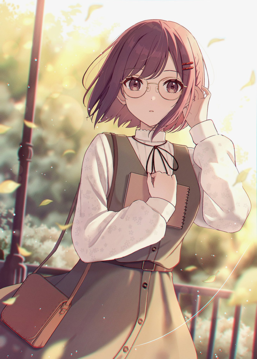 1girl bag blush brown_hair bush collared_shirt cowboy_shot day dress falling_leaves fence glasses green_dress hair_ornament hairpin hand_in_own_hair hand_up handbag highres holding holding_sketchbook hugging_object lamppost leaf lens_flare long_sleeves looking_at_viewer miton_(1521084393405571072) nose_pads outdoors parted_lips project_sekai shinonome_ena shirt short_hair sidelocks sketchbook sleeve_cuffs sleeveless sleeveless_dress solo swept_bangs tree white_shirt