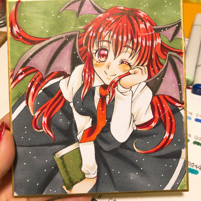 1girl absurdres ayanagi_honpo bat_wings black_skirt black_vest book breasts closed_mouth collared_shirt cowboy_shot green_background hair_between_eyes hand_on_own_cheek hand_on_own_face head_wings highres holding holding_book koakuma light_smile long_hair looking_at_viewer marker_(medium) medium_breasts necktie one_eye_closed photo_(medium) red_eyes red_necktie redhead shirt simple_background skirt skirt_set solo touhou traditional_media vest white_shirt wings