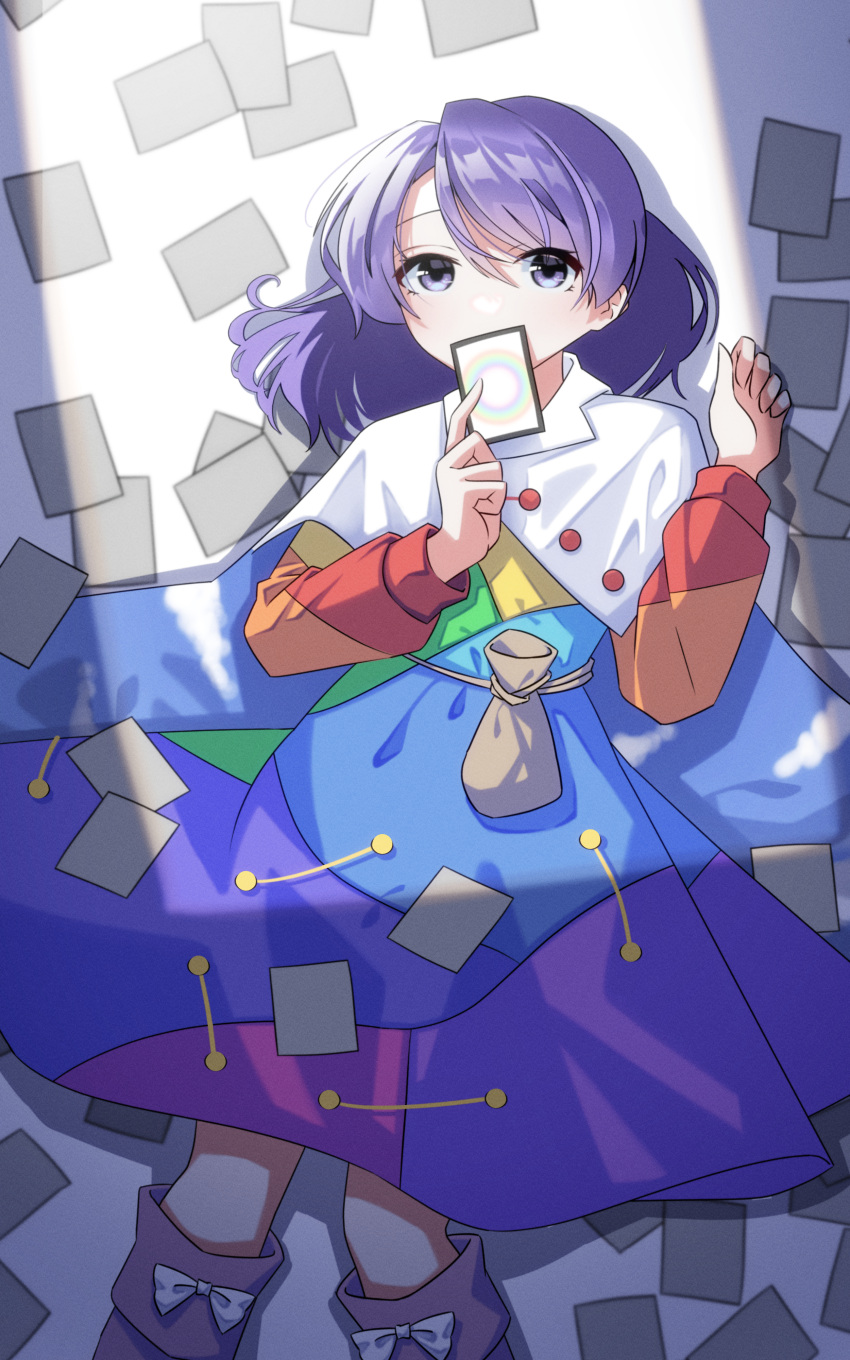1girl absurdres belt_pouch card commentary_request covered_mouth dress feet_out_of_frame highres holding holding_card long_sleeves looking_at_viewer lying medium_hair multicolored_clothes multicolored_dress on_back patchwork_clothes pouch purple_hair shishidonagi solo tenkyuu_chimata touhou unconnected_marketeers violet_eyes