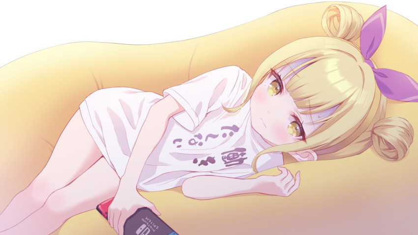 1girl blonde_hair blush chitosezaka_suzu closed_mouth clothes_writing commentary_request commission double_bun feet_out_of_frame hair_bun hair_ribbon hand_up highres holding indie_virtual_youtuber looking_at_viewer lying naopi_(vtuber) nintendo_switch on_side purple_ribbon ribbon shirt short_sleeves sidelocks skeb_commission solo sweat virtual_youtuber white_background white_shirt yellow_eyes