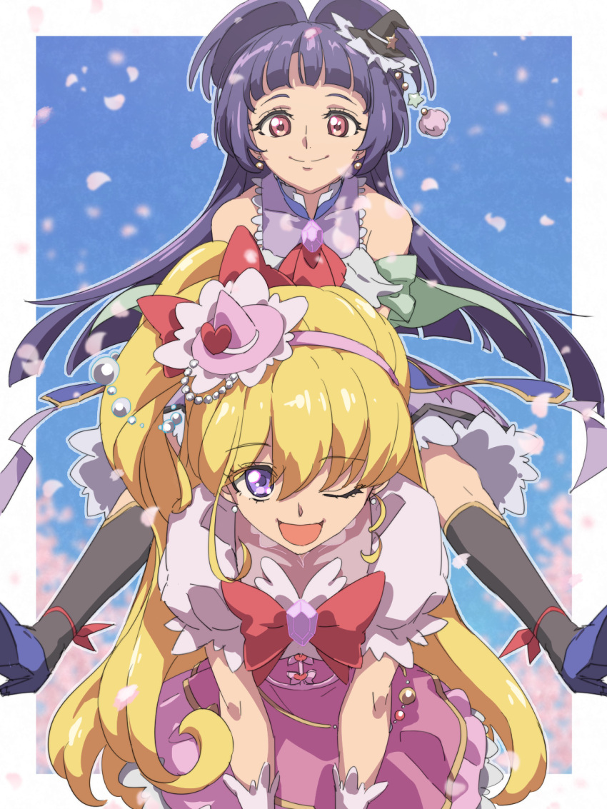 2girls :d arched_bangs asahina_mirai black_hat black_socks blonde_hair blue_background blue_footwear blue_hair border carrying chiharu_(9654784) closed_mouth commentary_request cure_magical cure_miracle dress falling_petals hairband hat highres izayoi_liko long_hair mahou_girls_precure! multiple_girls one_eye_closed open_mouth outside_border petals piggyback pink_dress pink_hairband precure red_eyes smile socks violet_eyes white_border witch_hat