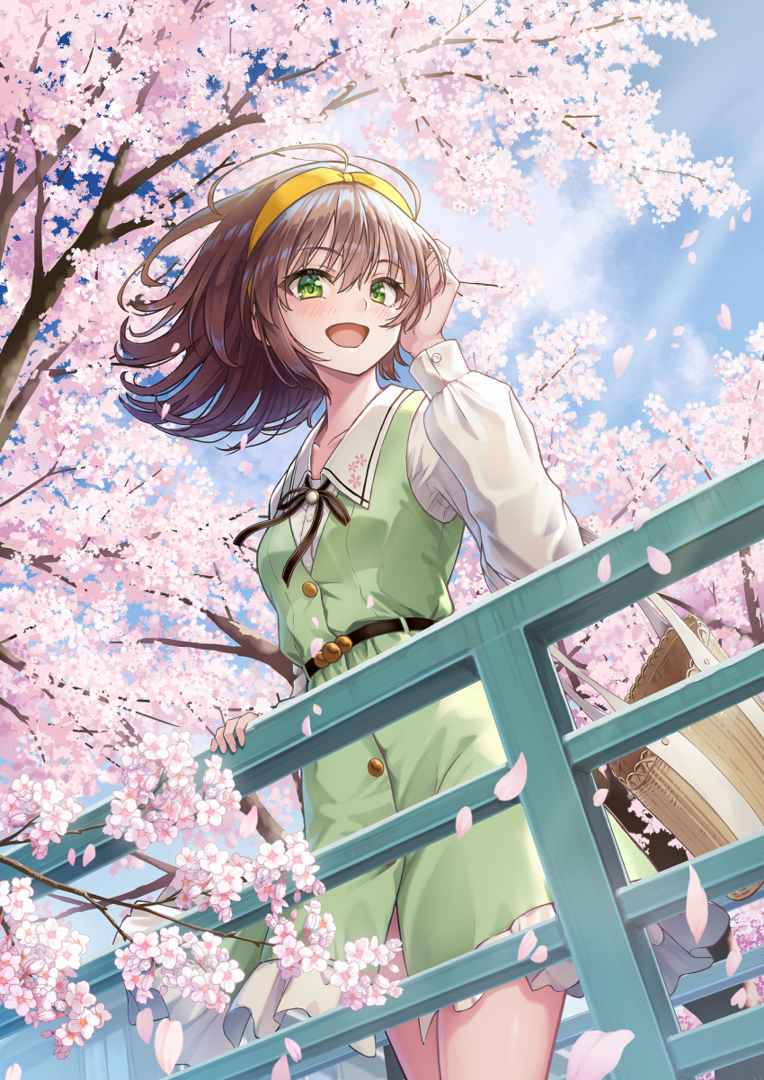 1girl against_railing belt blue_sky brown_hair cherry_blossoms clouds dress frilled_dress frills from_below green_dress green_eyes hairband hand_on_railing highres holding long_sleeves looking_to_the_side macha0331 medium_hair open_mouth original outdoors railing shirt sky smile white_shirt yellow_hairband