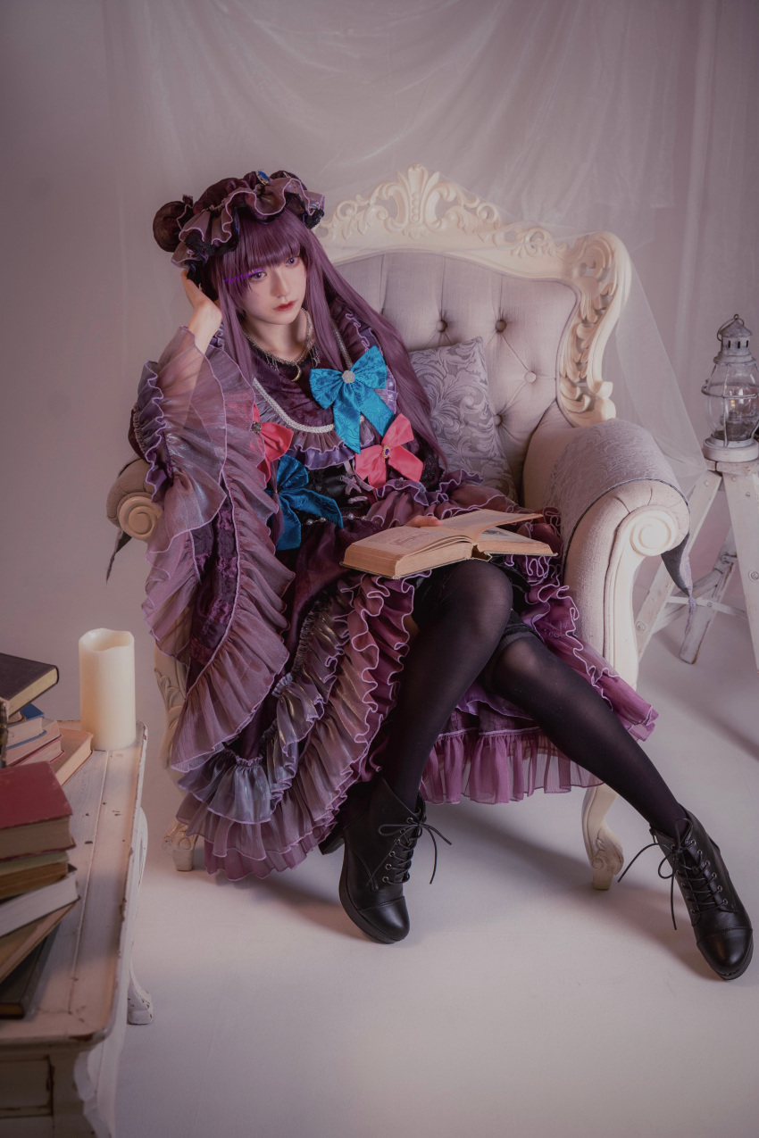 1girl absurdres armchair black_footwear blue_bow blunt_bangs book book_stack boots bow candle chair closed_mouth cosplay cosplay_photo curtains dress frills full_body hand_on_own_head hat high_heels highres holding holding_book indoors lantern long_hair long_sleeves looking_at_viewer mob_cap open_book patchouli_knowledge photo_(medium) purple_dress purple_hair ribbon shoelaces sitting solo striped_clothes table tartetatin0516 thigh-highs touhou violet_eyes wide_sleeves