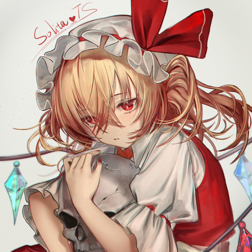 1girl artist_name blonde_hair crystal_wings flandre_scarlet hat hat_ribbon highres hugging_object medium_hair open_mouth puffy_short_sleeves puffy_sleeves red_eyes red_ribbon ribbon short_sleeves side_ponytail simple_background skull solita_ts solo touhou upper_body white_background