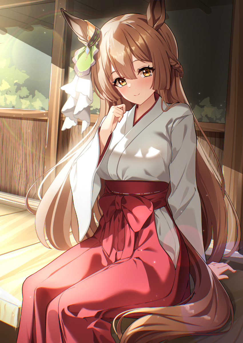 1girl absurdres alternate_costume animal_ears blush braid breasts brown_hair closed_mouth commentary_request ear_ornament french_braid hair_between_eyes hair_ornament hakama highres horse_ears horse_girl horse_tail japanese_clothes kimono long_hair long_sleeves medium_breasts miko multicolored_hair outdoors red_hakama satono_diamond_(umamusume) sitting smile solo streaked_hair sunny_(20597521) tail tail_through_clothes umamusume white_hair wide_sleeves