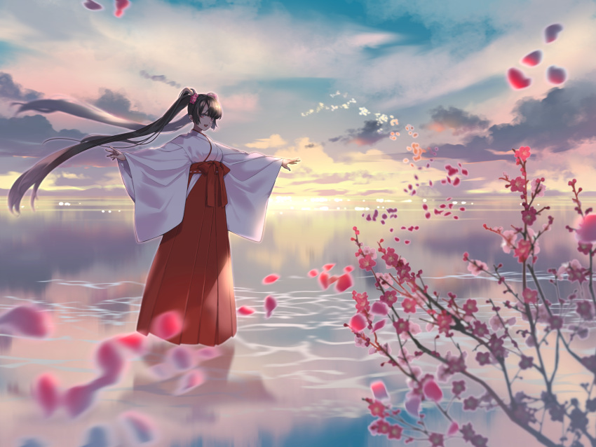 1girl absurdres black_hair clouds commentary_request flower full_body hair_flower hair_ornament hakama hakama_skirt highres horizon japanese_clothes kimono long_hair looking_at_viewer miko open_mouth original outstretched_arms petals plum_blossoms red_eyes red_hakama scenery skirt sky smile solo spread_arms sunrise taka_oedo twintails very_long_hair water white_kimono
