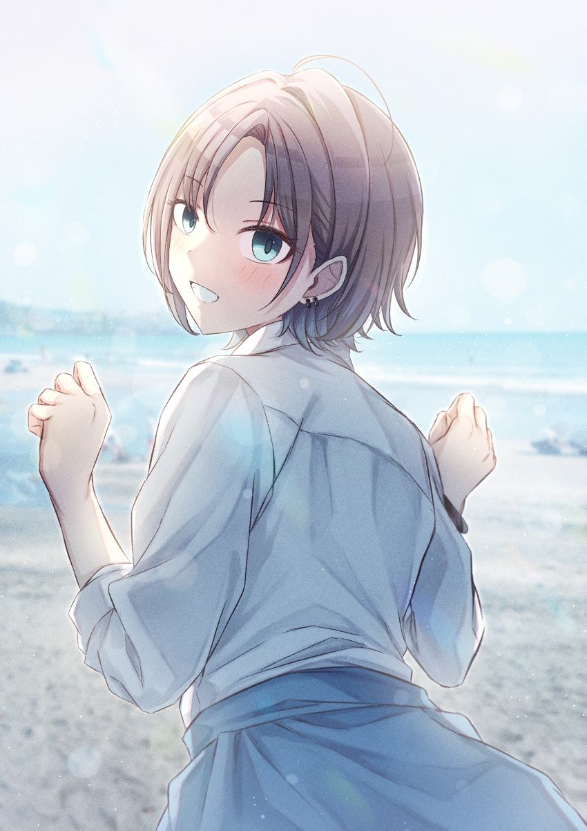 1girl absurdres ahoge asakura_toru beach blue_cardigan blush cardigan cardigan_around_waist ch13 clothes_around_waist commentary earrings from_behind grin highres idolmaster idolmaster_shiny_colors jewelry looking_at_viewer looking_back outdoors school_uniform shirt smile solo white_shirt