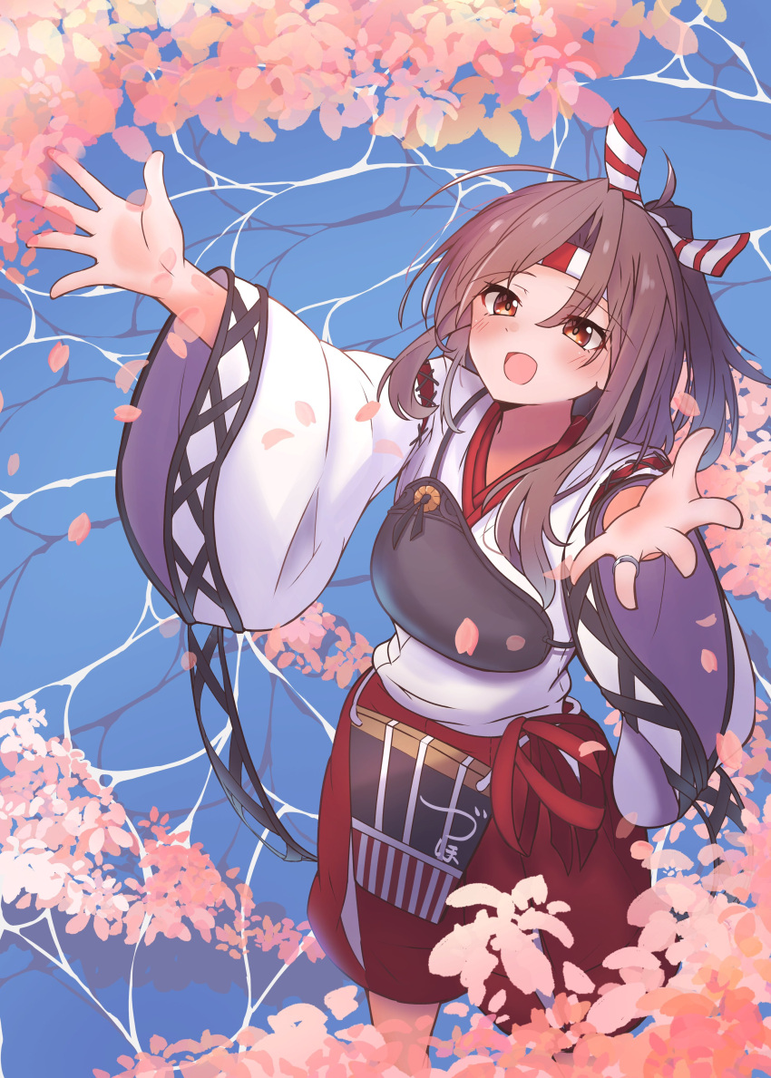 1girl 702_(naotsu) absurdres apron brown_eyes brown_hair cherry_blossoms commentary_request feet_out_of_frame flight_deck hachimaki hakama hakama_shorts headband high_ponytail highres japanese_clothes kantai_collection muneate red_shorts shorts smile solo striped_headband water zuihou_(kancolle)