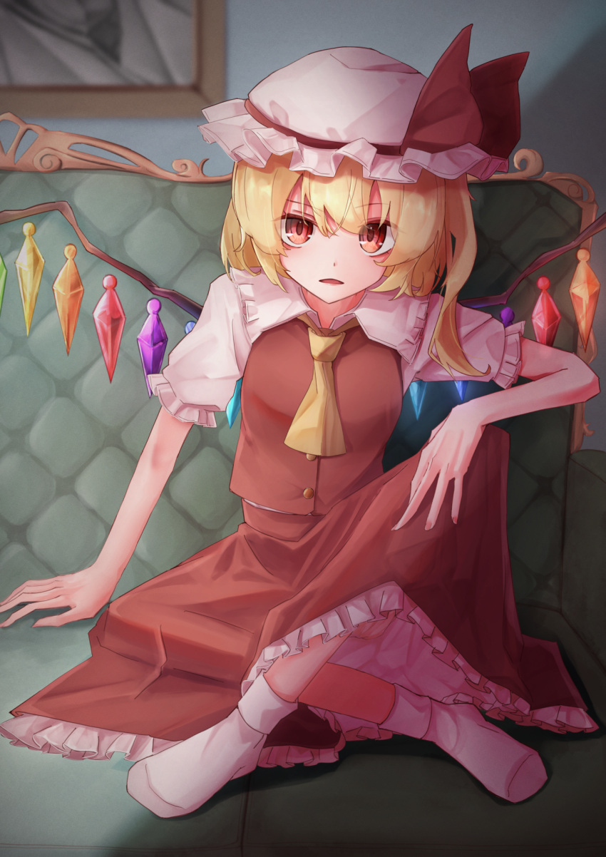 1girl ascot blonde_hair couch crossed_legs crystal_wings flandre_scarlet frills hat hat_ribbon highres looking_at_viewer mob_cap on_couch open_mouth puffy_short_sleeves puffy_sleeves red_eyes red_ribbon ribbon short_sleeves side_ponytail sitting taguno touhou yellow_ascot