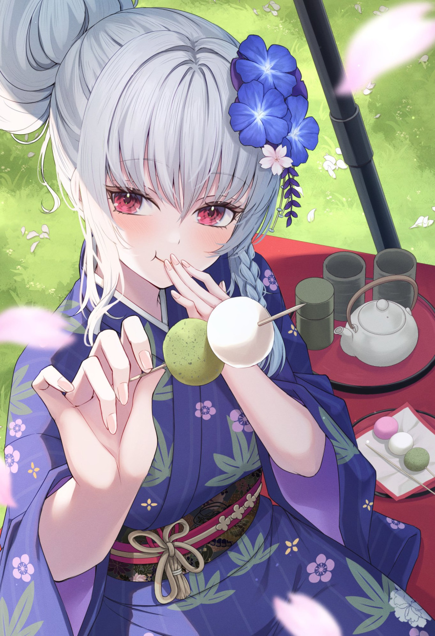 1girl blue_archive blue_flower blurry blush braid commentary_request cup dango day depth_of_field eating falling_petals floral_print_kimono flower food food_in_mouth grass grey_halo hair_bun hair_flower hair_ornament halo haruna_(blue_archive) haruna_(new_year)_(blue_archive) highres holding holding_food japanese_clothes kimono long_sleeves looking_at_viewer obi obijime official_alternate_costume official_alternate_hairstyle outdoors petals primamiya purple_kimono red_eyes sash single_braid single_hair_bun solo teapot wagashi wide_sleeves