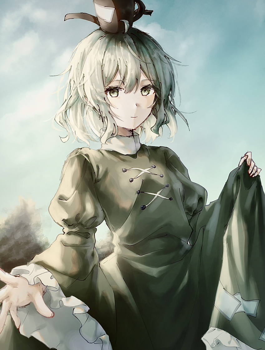 0801_nu 1girl black_hat closed_mouth cross-laced_clothes dress green_dress green_eyes green_hair hat highres juliet_sleeves long_sleeves looking_at_viewer ofuda ofuda_on_clothes outdoors puffy_sleeves short_hair sky soga_no_tojiko solo tate_eboshi touhou wide_sleeves