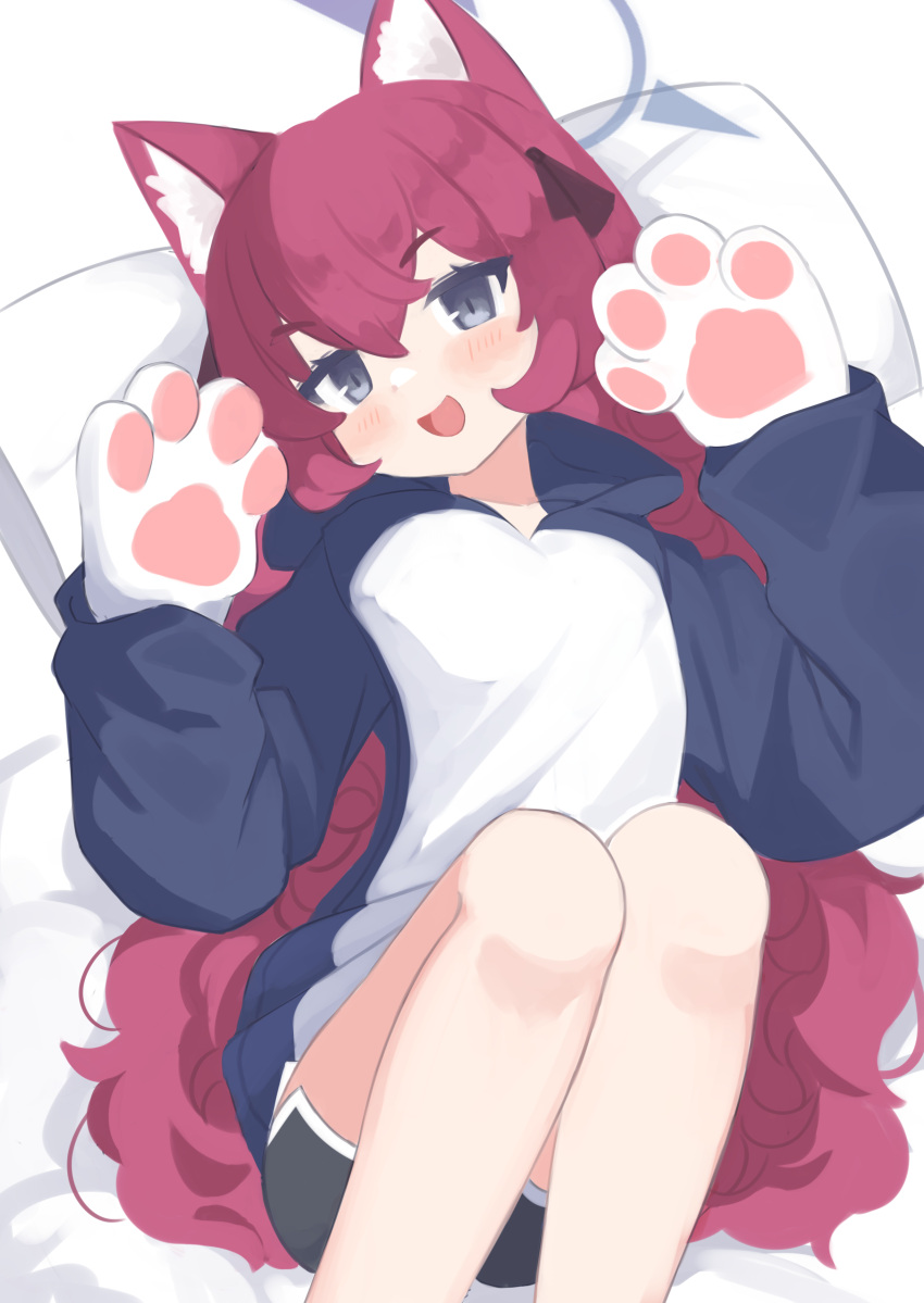 1girl absurdres animal_ear_fluff animal_ears animal_hands anma21 black_shorts blue_archive blue_halo blue_hoodie blush cat_ears fake_animal_ears feet_out_of_frame gloves grey_eyes hair_between_eyes halo hands_up highres hood hoodie iroha_(blue_archive) knees_up long_hair long_sleeves looking_at_viewer lying on_back open_mouth paw_gloves paw_pose pillow redhead shorts simple_background solo very_long_hair wavy_hair white_background