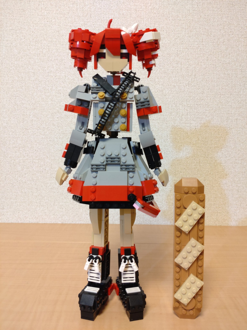 1girl ahoge arms_at_sides baguette black_footwear boots bread buttons choroli_(chorolin) double-breasted drill_hair food full_body grey_jacket grey_skirt hair_between_eyes hair_ribbon highres jacket kasane_teto kasane_teto_(sv) lego_(medium) long_sleeves looking_at_viewer oversized_food oversized_object red_eyes redhead ribbon shoulder_belt skirt solo standing straight-on synthesizer_v twin_drills unconventional_media utau white_ribbon