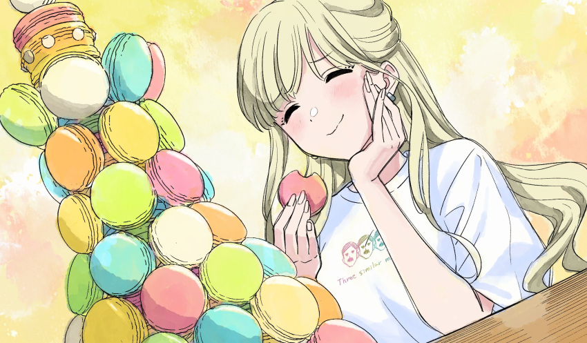 1girl ^_^ akroglam blonde_hair closed_eyes closed_mouth commentary_request eating eno_(akroglam) facing_viewer food hand_on_own_cheek hand_on_own_face hands_up highres holding holding_food long_hair macaron macaron_tower official_art second-party_source shirt short_sleeves smile solo t-shirt too_many upper_body white_shirt