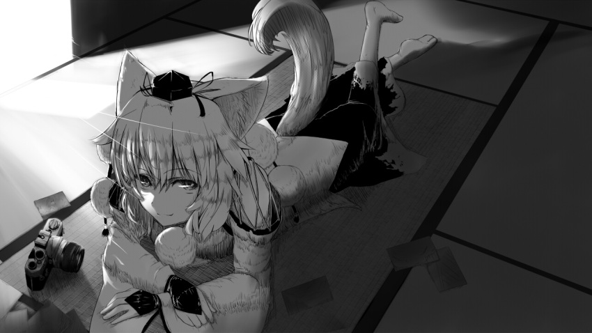animal_ears bare_shoulders bridal_gauntlets camera detached_sleeves fang hat inubashiri_momiji looking_at_viewer lying monochrome on_stomach pen_(pixiv257621) photo_(object) picture short_hair smile solo tail tatami tokin_hat touhou wolf_ears wolf_tail