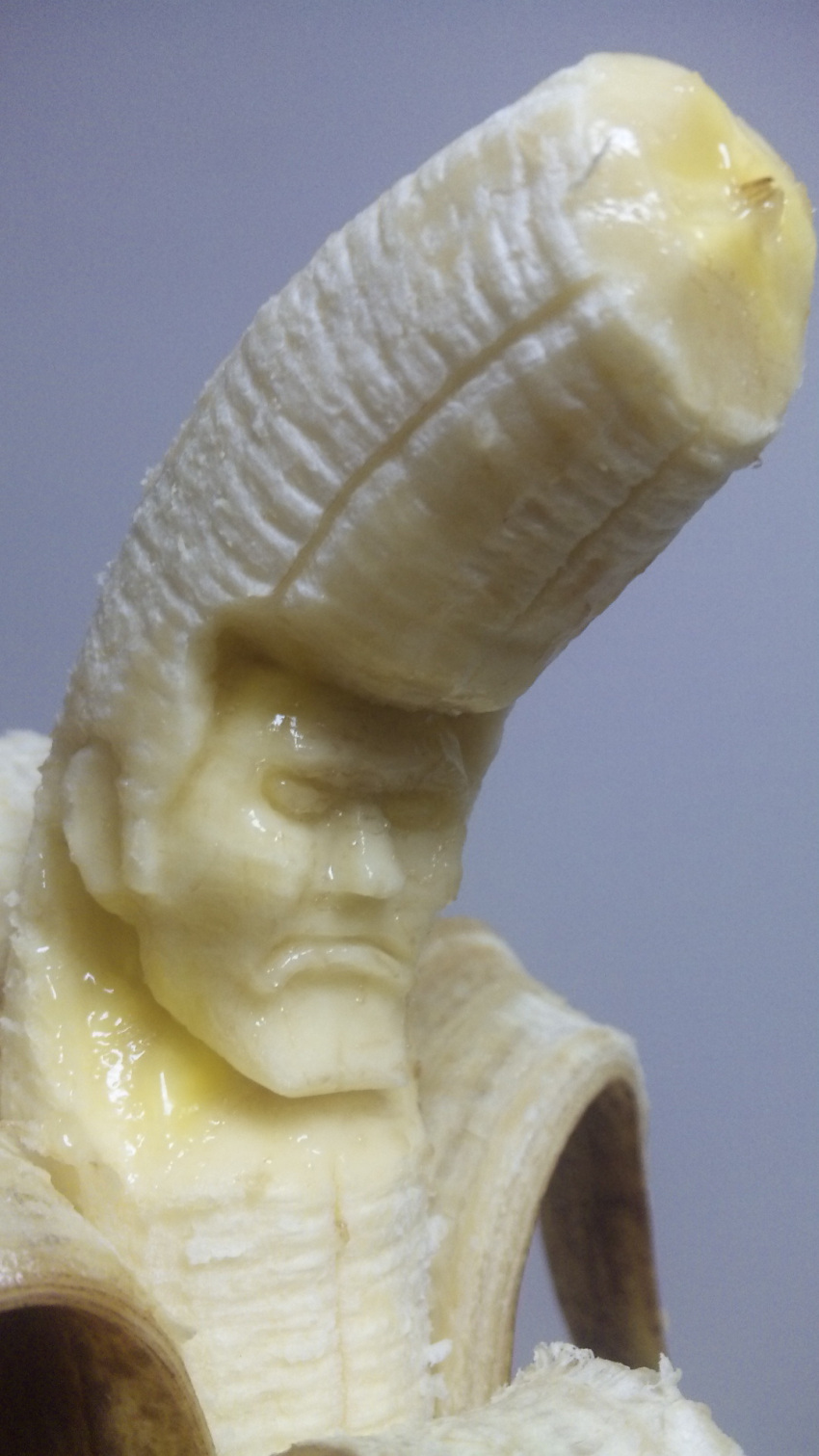 banana delinquent epic food frown fruit highres male manly photo pompadour sculpture solo suu_(banana) what y_yamaden