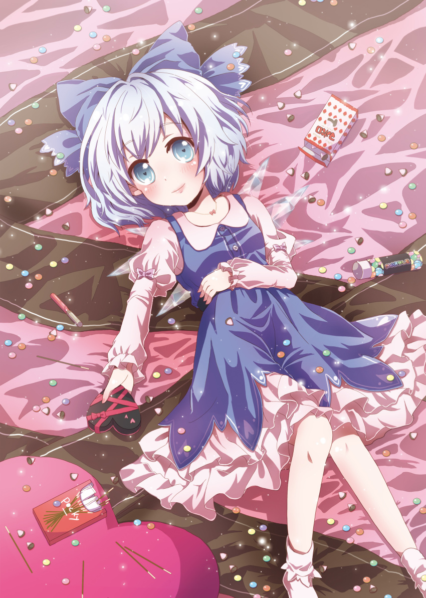 absurdres adapted_costume blue_eyes blue_hair bow candy cirno footwear gift hair_bow heart heart-shaped_pupils highres ice ice_wings kuromame_(8gou) lying pocky short_hair smile socks solo symbol-shaped_pupils touhou wings